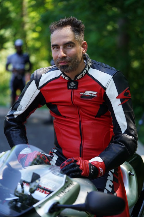 The photographer-motorcyclist-paintballer known as The Kingpin shot with 90 mm 2.8 wide open with one reflector off to the side.